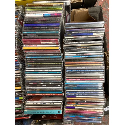 1516 - Two boxes containing a collection of CD singles