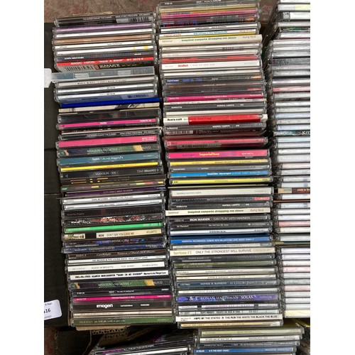 1516 - Two boxes containing a collection of CD singles