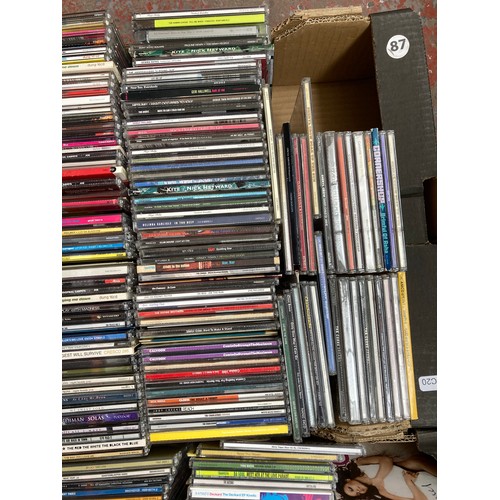 1516 - Two boxes containing a collection of CD singles