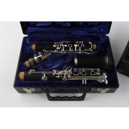 835 - Two cased vintage clarinets, one incomplete Armstrong and one Artley