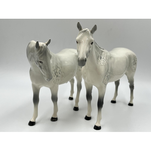 252 - Two Beswick dapple grey horse figurines - tallest approx. 20cm high