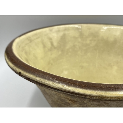 261 - A glazed earthenware dairy bowl - approx. 15cm high x 31cm diameter