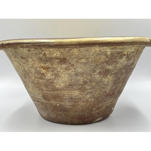 261 - A glazed earthenware dairy bowl - approx. 15cm high x 31cm diameter