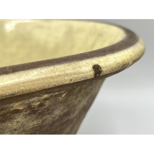 261 - A glazed earthenware dairy bowl - approx. 15cm high x 31cm diameter