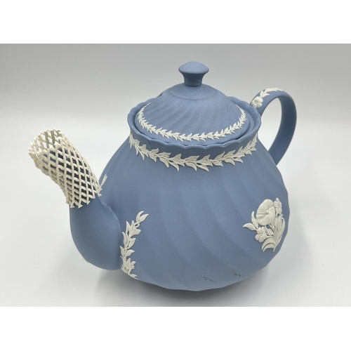 274 - Two pieces of Wedgwood pale blue Jasperware, 15cm teapot and 8cm milk jug