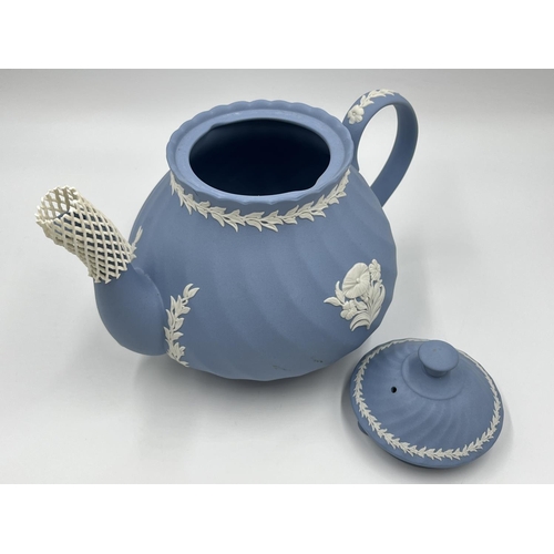 274 - Two pieces of Wedgwood pale blue Jasperware, 15cm teapot and 8cm milk jug