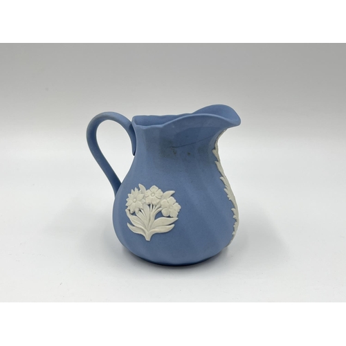 274 - Two pieces of Wedgwood pale blue Jasperware, 15cm teapot and 8cm milk jug