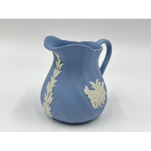 274 - Two pieces of Wedgwood pale blue Jasperware, 15cm teapot and 8cm milk jug