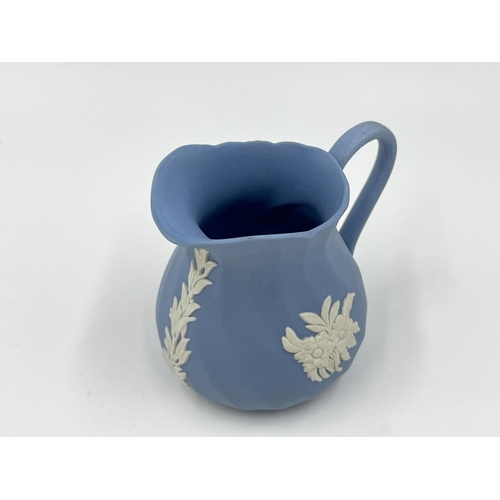 274 - Two pieces of Wedgwood pale blue Jasperware, 15cm teapot and 8cm milk jug