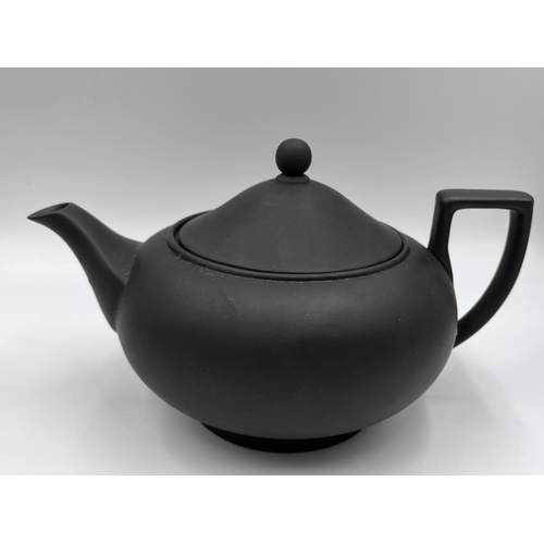 279 - A Wedgwood black basalt three piece tea set comprising 13cm teapot, 7.5cm milk jug and 6.5cm bowl