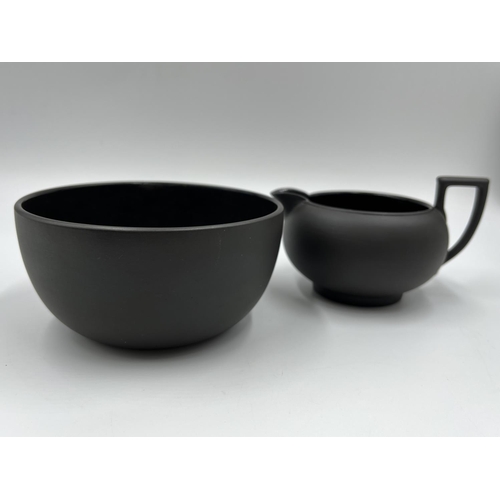 279 - A Wedgwood black basalt three piece tea set comprising 13cm teapot, 7.5cm milk jug and 6.5cm bowl