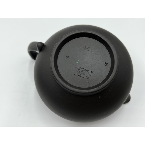 279 - A Wedgwood black basalt three piece tea set comprising 13cm teapot, 7.5cm milk jug and 6.5cm bowl