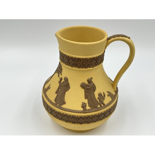 289 - A Wedgwood Taupe on cane Jasperware Etruscan jug - approx. 13cm high