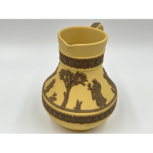 289 - A Wedgwood Taupe on cane Jasperware Etruscan jug - approx. 13cm high