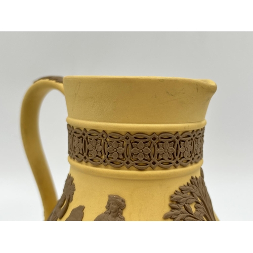 289 - A Wedgwood Taupe on cane Jasperware Etruscan jug - approx. 13cm high