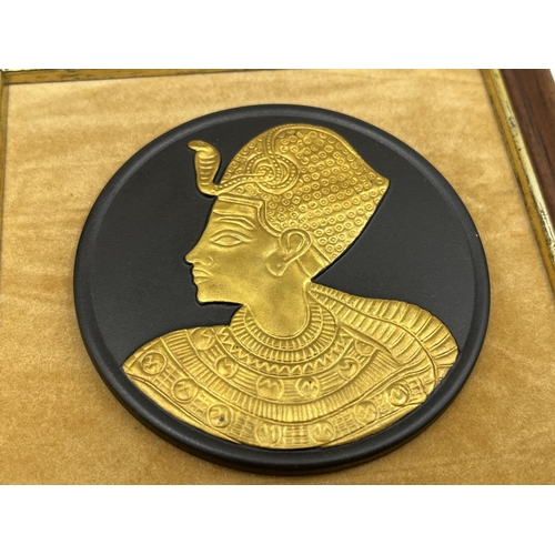 292 - Two framed Wedgwood Egyptian Collection black basalt and gilt relief plaques - approx. 13cm x 13cm