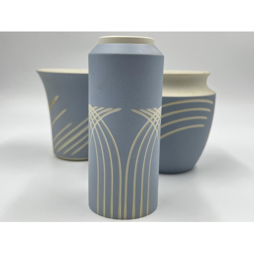 294 - Three Wedgwood Symmetry pattern pale blue Jasperware vases - largest approx. 12cm high