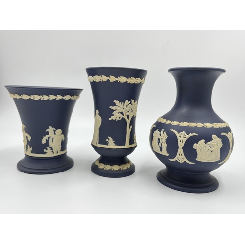 296 - Three Wedgwood Portland blue Jasperware vases - largest approx. 12.5cm high