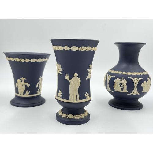 296 - Three Wedgwood Portland blue Jasperware vases - largest approx. 12.5cm high