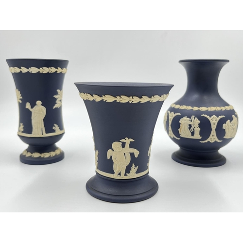 296 - Three Wedgwood Portland blue Jasperware vases - largest approx. 12.5cm high