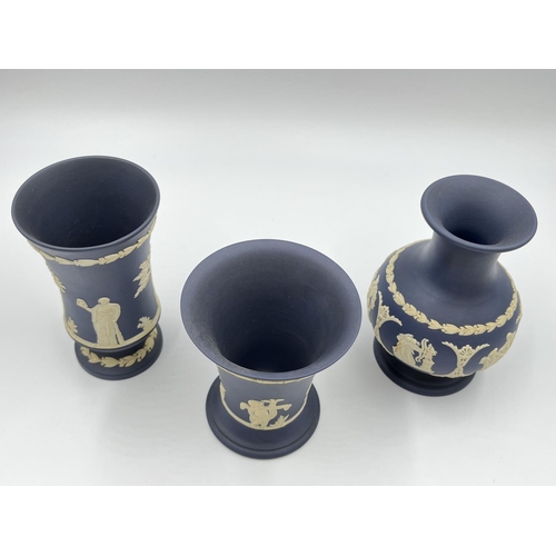 296 - Three Wedgwood Portland blue Jasperware vases - largest approx. 12.5cm high