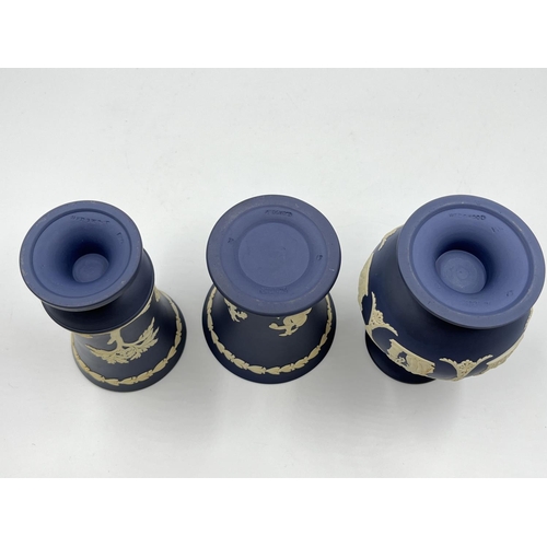 296 - Three Wedgwood Portland blue Jasperware vases - largest approx. 12.5cm high