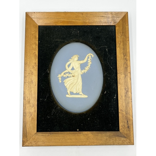 300 - Three framed Wedgwood pale blue Jasperware plaques - largest approx. 24cm high x 19cm wide