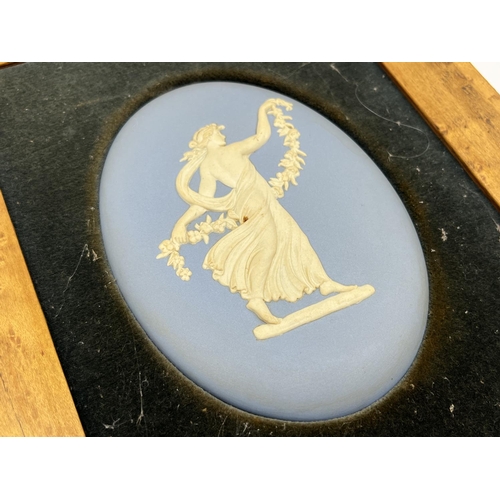 300 - Three framed Wedgwood pale blue Jasperware plaques - largest approx. 24cm high x 19cm wide