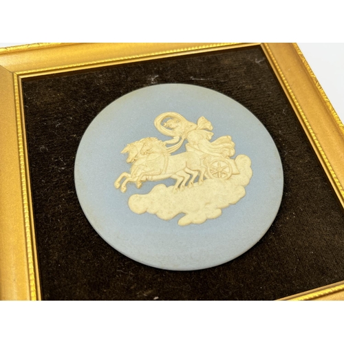 300 - Three framed Wedgwood pale blue Jasperware plaques - largest approx. 24cm high x 19cm wide