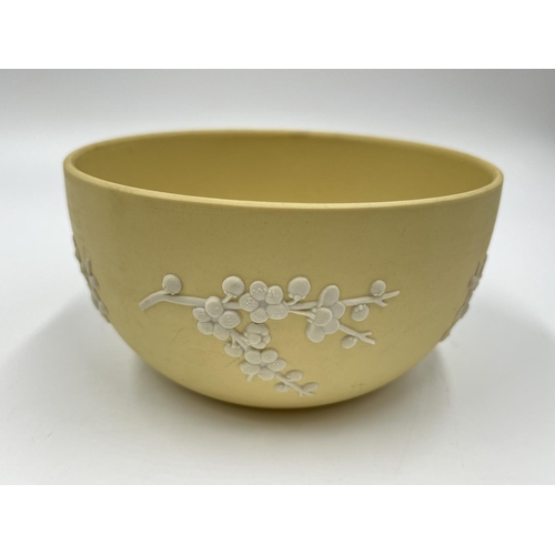 303 - Two pieces of Wedgwood primrose yellow Prunus Blossom Jasperware, one 12.5cm bowl and one 21cm plate