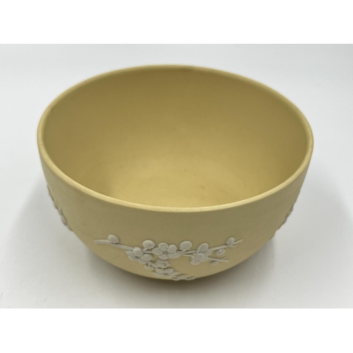 303 - Two pieces of Wedgwood primrose yellow Prunus Blossom Jasperware, one 12.5cm bowl and one 21cm plate