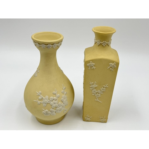 304 - Two Wedgwood primrose yellow Prunus Blossom vases - largest approx. 14cm high