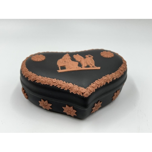 306 - Two pieces of Wedgwood terracotta and black Jasperware, one heart shaped trinket box and one boxed m... 