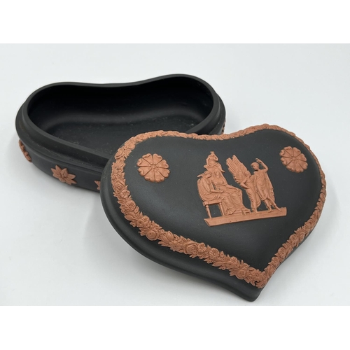 306 - Two pieces of Wedgwood terracotta and black Jasperware, one heart shaped trinket box and one boxed m... 