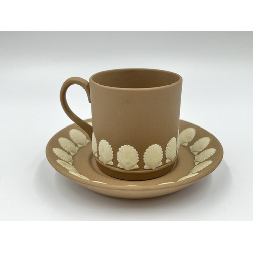 313 - Three pieces of Wedgwood shell design Taupe Jasperware, one 13cm jug and one coffee cup and saucer