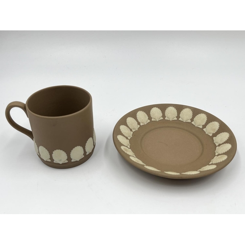 313 - Three pieces of Wedgwood shell design Taupe Jasperware, one 13cm jug and one coffee cup and saucer