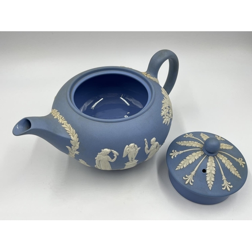 330 - Three pieces of Wedgwood pale blue Jasperware, teapot, sugar bowl and milk jug