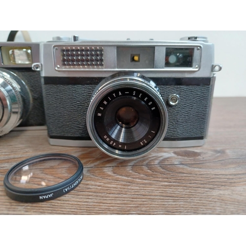 761 - Three vintage 35mm cameras, one 1960s Voigtländer Vito C 35mm viewfinder fitted with Color-Skopar 2.... 