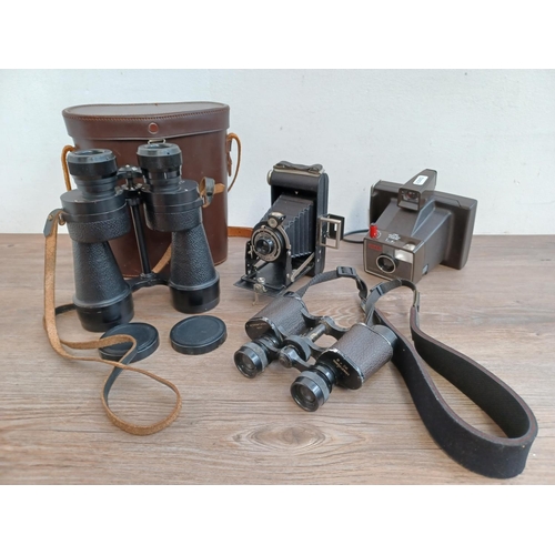 765 - Four items, one cased pair of Ross Stepmur 10 x 50 binoculars, one Kodak Brownie Six-20 folding came... 