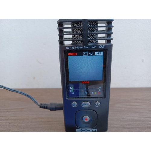 770 - A Zoom Q3 Handy Video Recorder with power adaptor and quick start guide