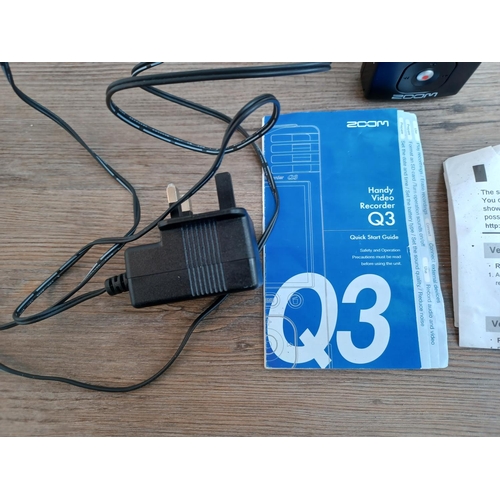 770 - A Zoom Q3 Handy Video Recorder with power adaptor and quick start guide