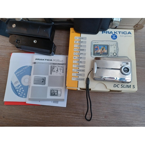 772 - A collection of items to include boxed and cased Praktica DC Slim 5 12mp compact digital camera with... 