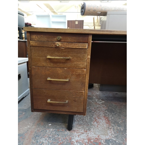 135A - A mid 20th century Abbess Linear teak office desk - approx. 72cm high x 153cm wide x 76cm deep