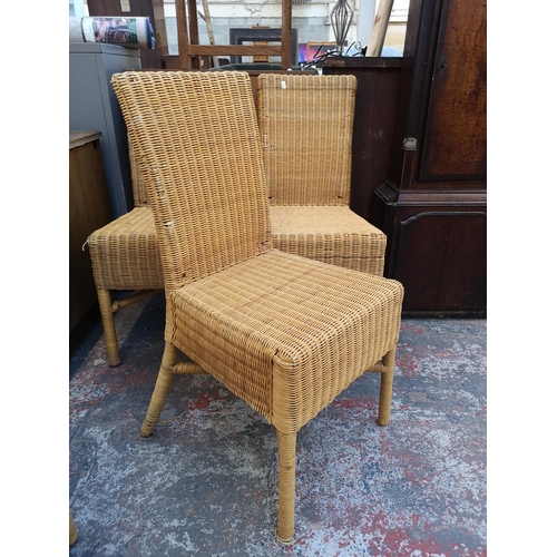 137 - A set of four modern wicker dining chairs