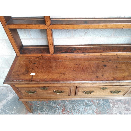 1 - A George III oak and mahogany crossbanded dresser base and plate rack - approx. 193cm high x 180cm w... 