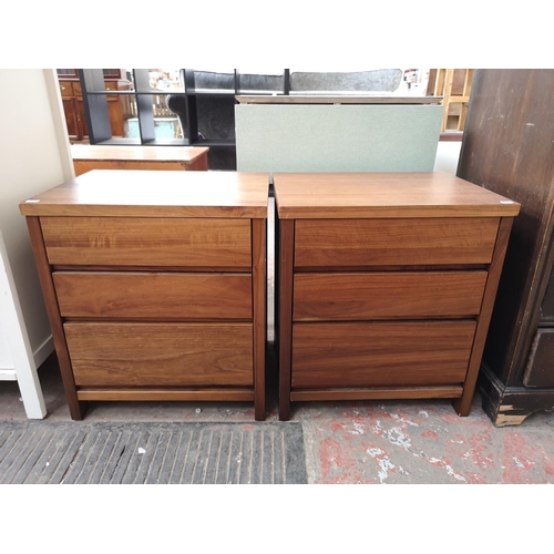 106 - A pair of teak effect bedside chests of three drawers - approx. 56cm high x 50cm wide x 40cm deep