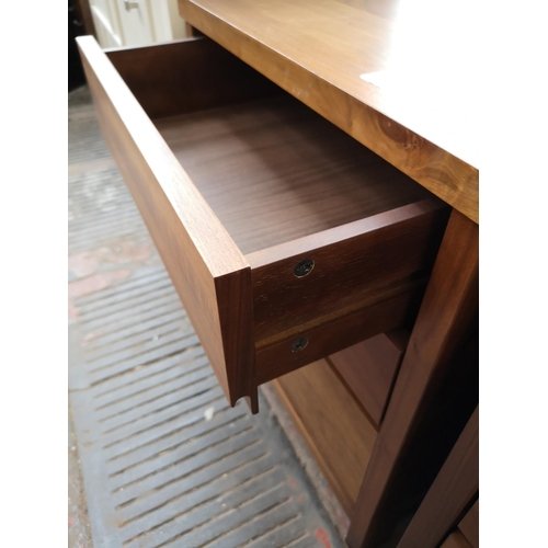 106 - A pair of teak effect bedside chests of three drawers - approx. 56cm high x 50cm wide x 40cm deep