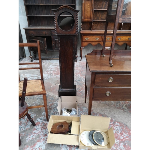 11 - An oak granddaughter clock case with various accessories