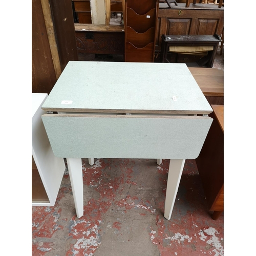 111 - A mid 20th century Nu-Lyne white painted and green laminate drop leaf table - approx. 77cm high x 60... 