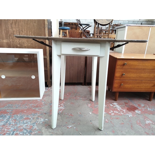 111 - A mid 20th century Nu-Lyne white painted and green laminate drop leaf table - approx. 77cm high x 60... 